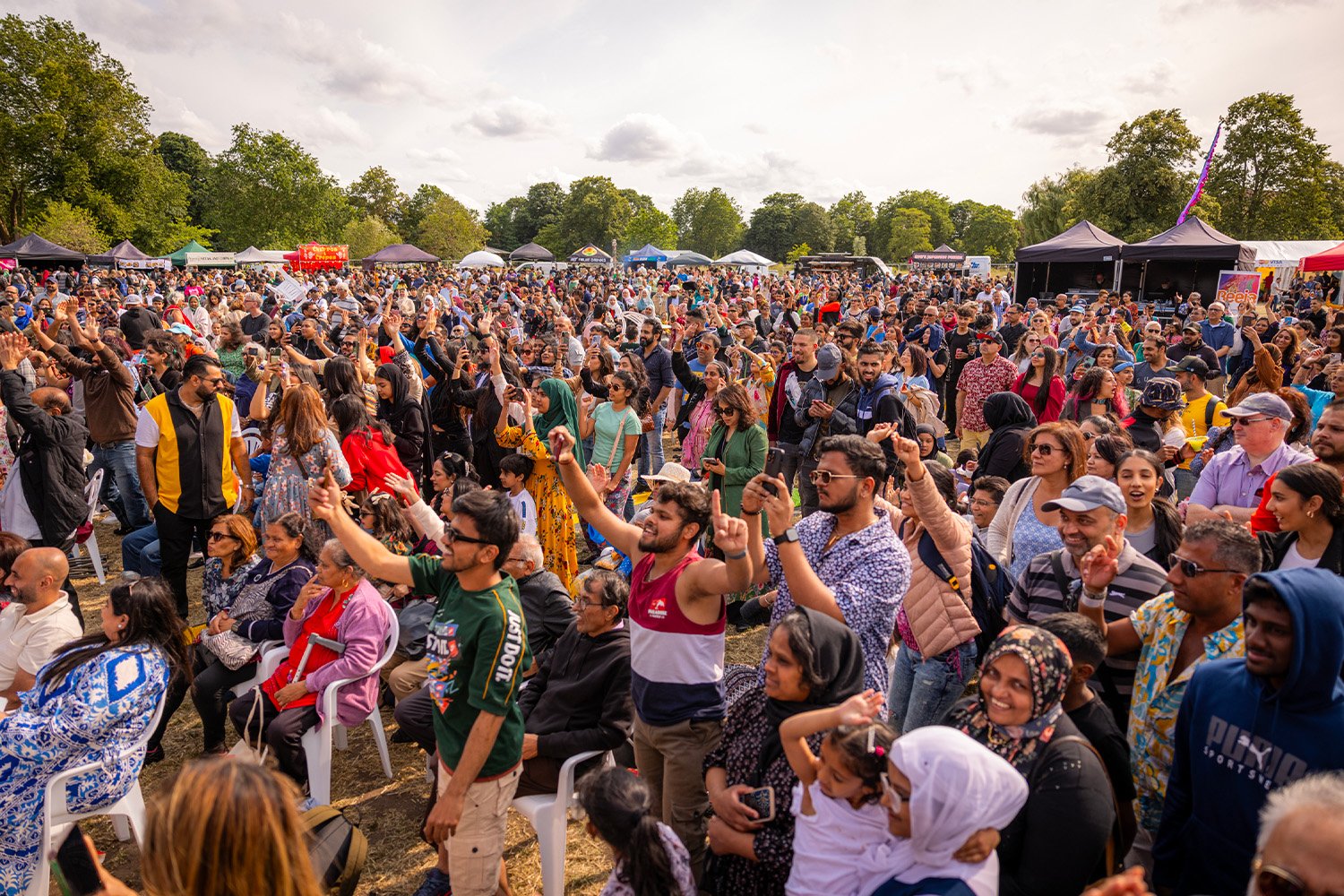 A crowd enjoying an outdoor community event