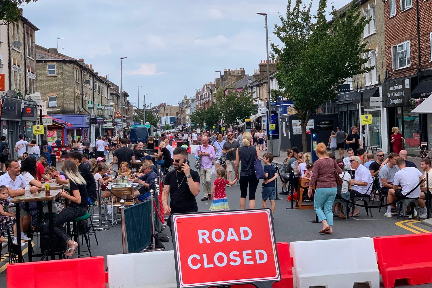 People gathering along a pedestrianised high street