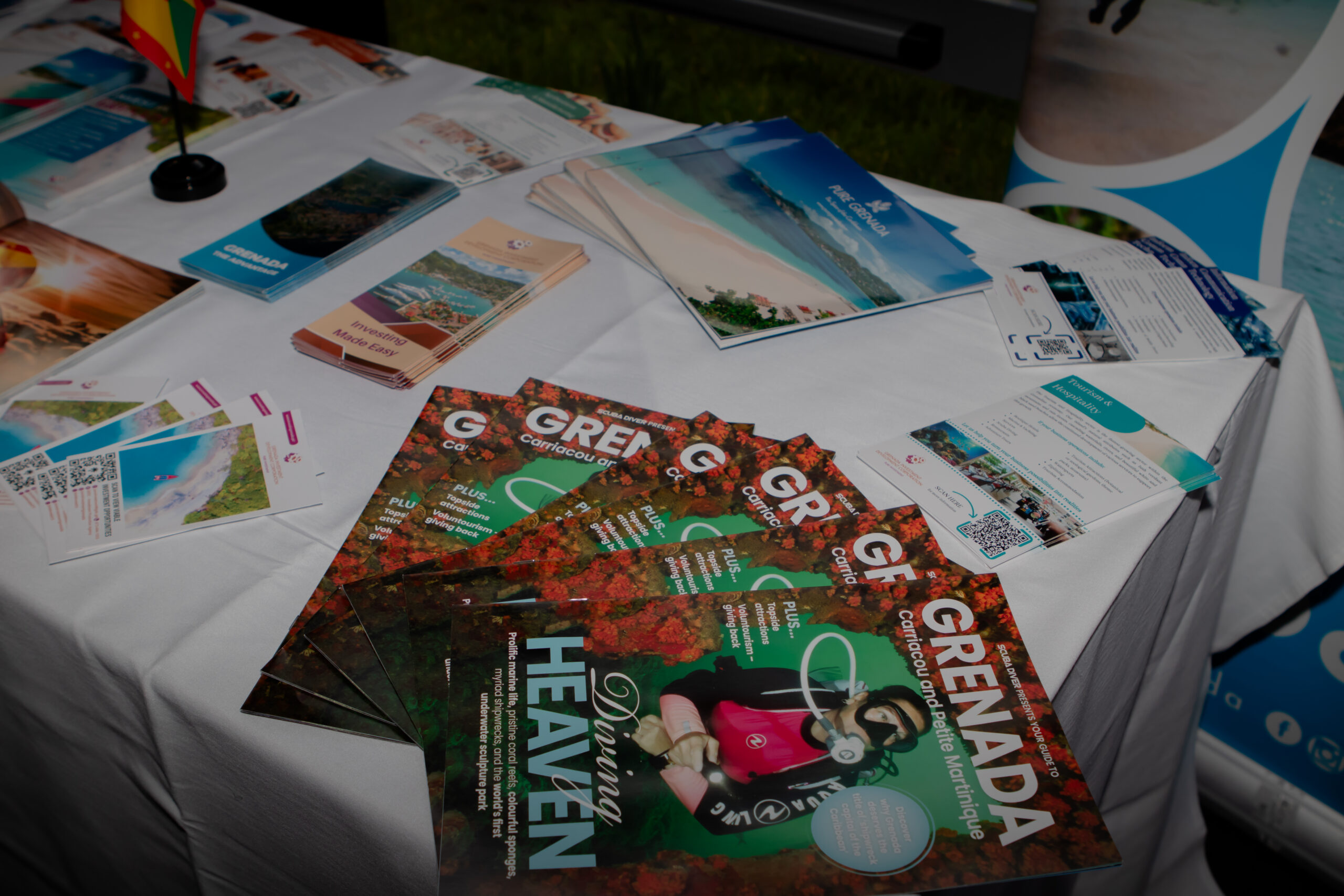 Brochures on an exhibition table at the Business Growth Summit